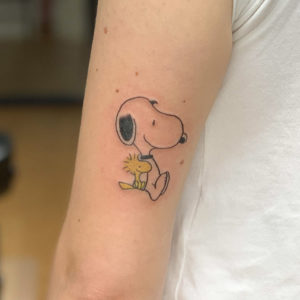 Snoopy tattoo by Chris McGuire