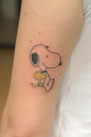 Snoopy tattoo by Chris McGuire