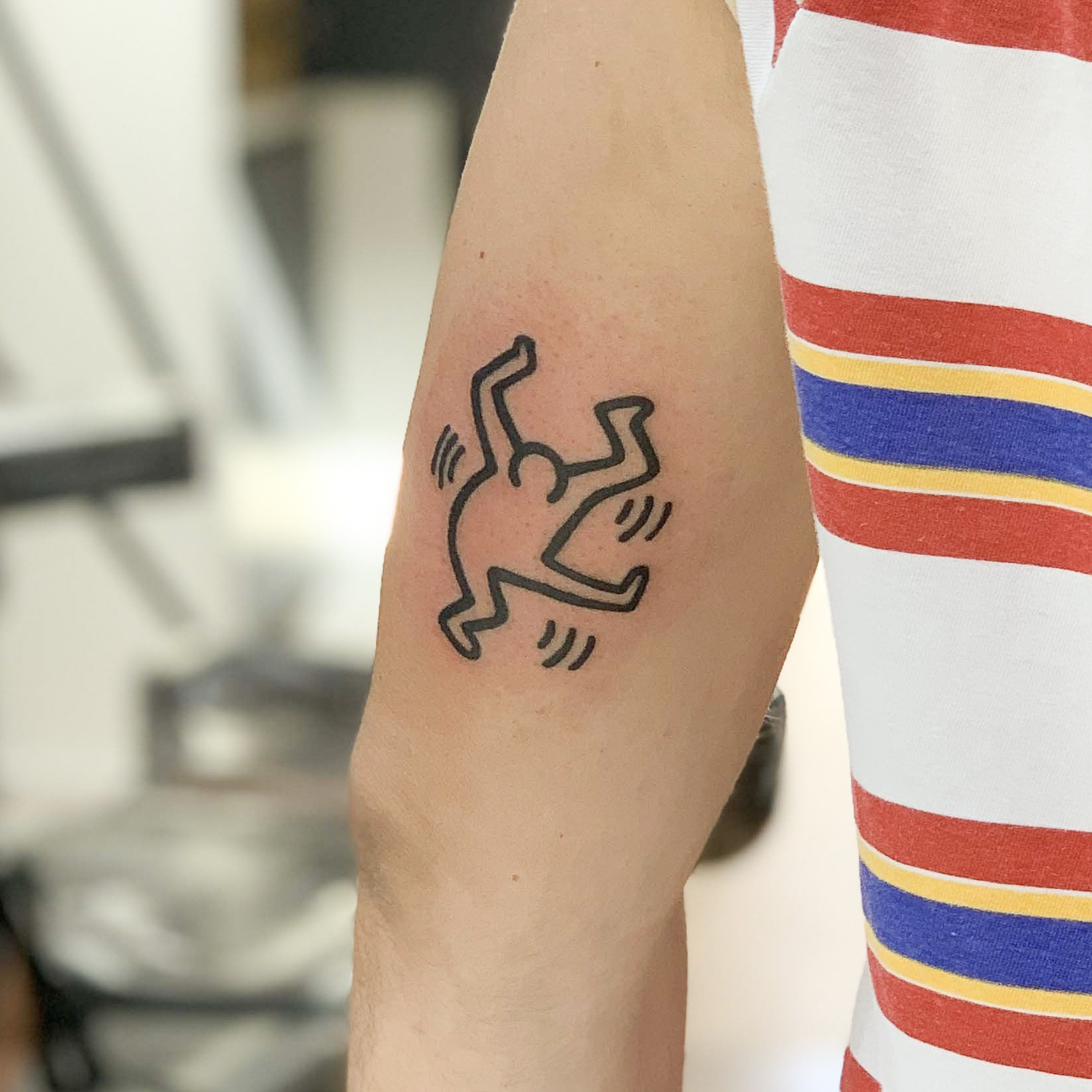 keith haring angel tattoo