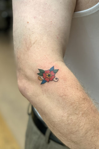 Blosson flower tattoo by Chris McGuire