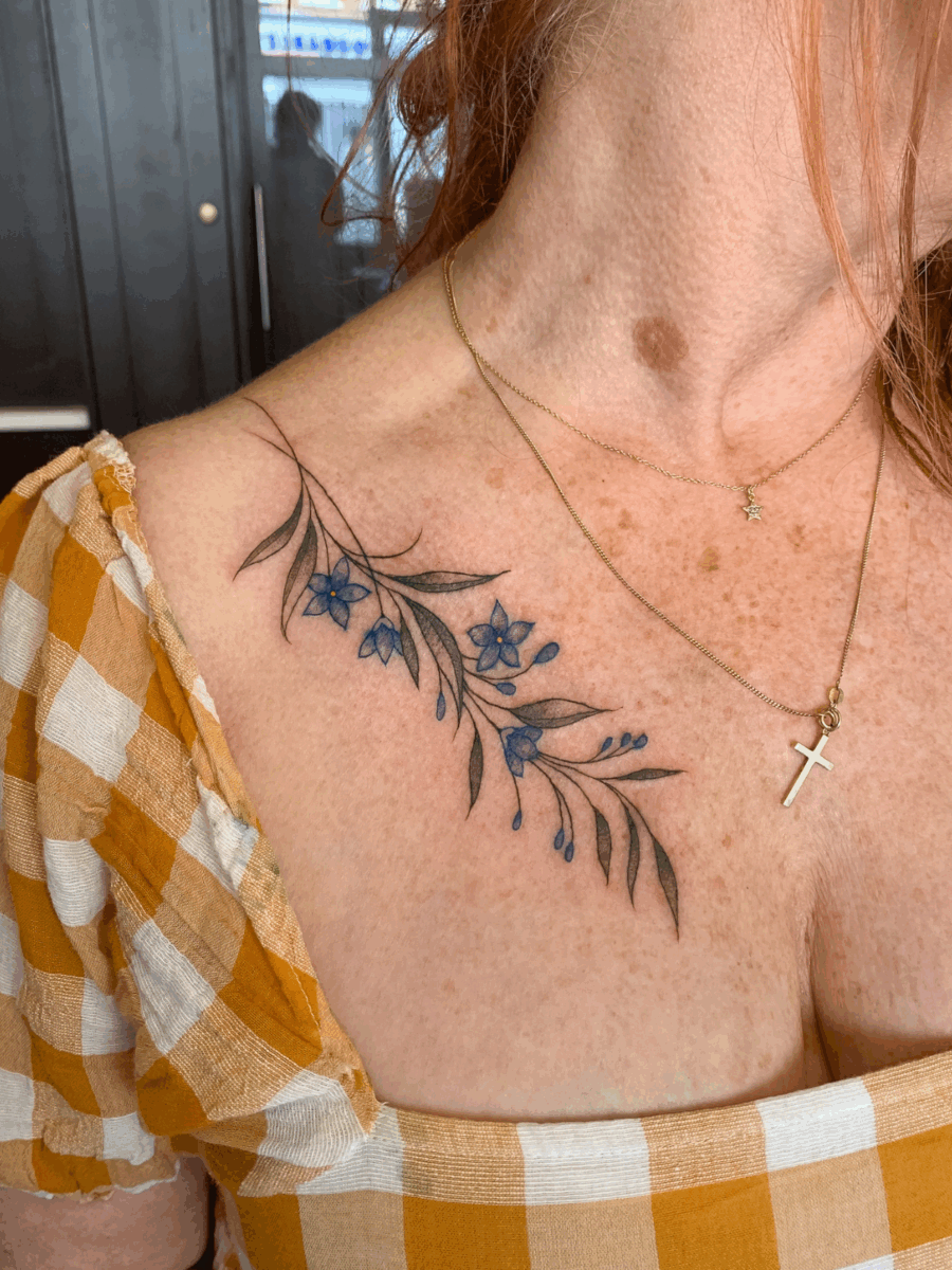 flowers on chest area at Storyville Tattoo Studio, London by Gabe