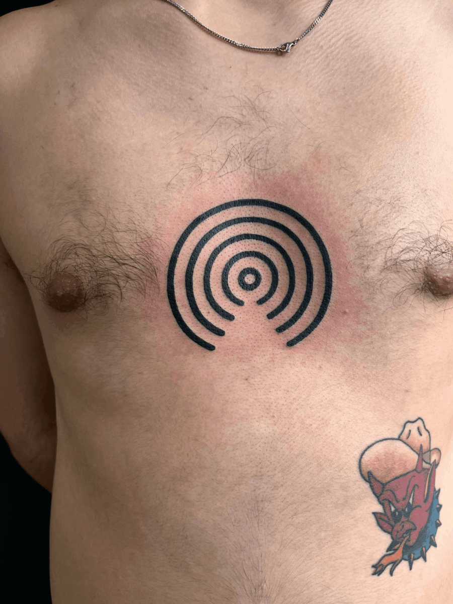 chest tattoo on ribs at Storyville Tattoo Studio London